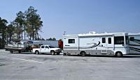 motorhome towing truck towing boat trailer